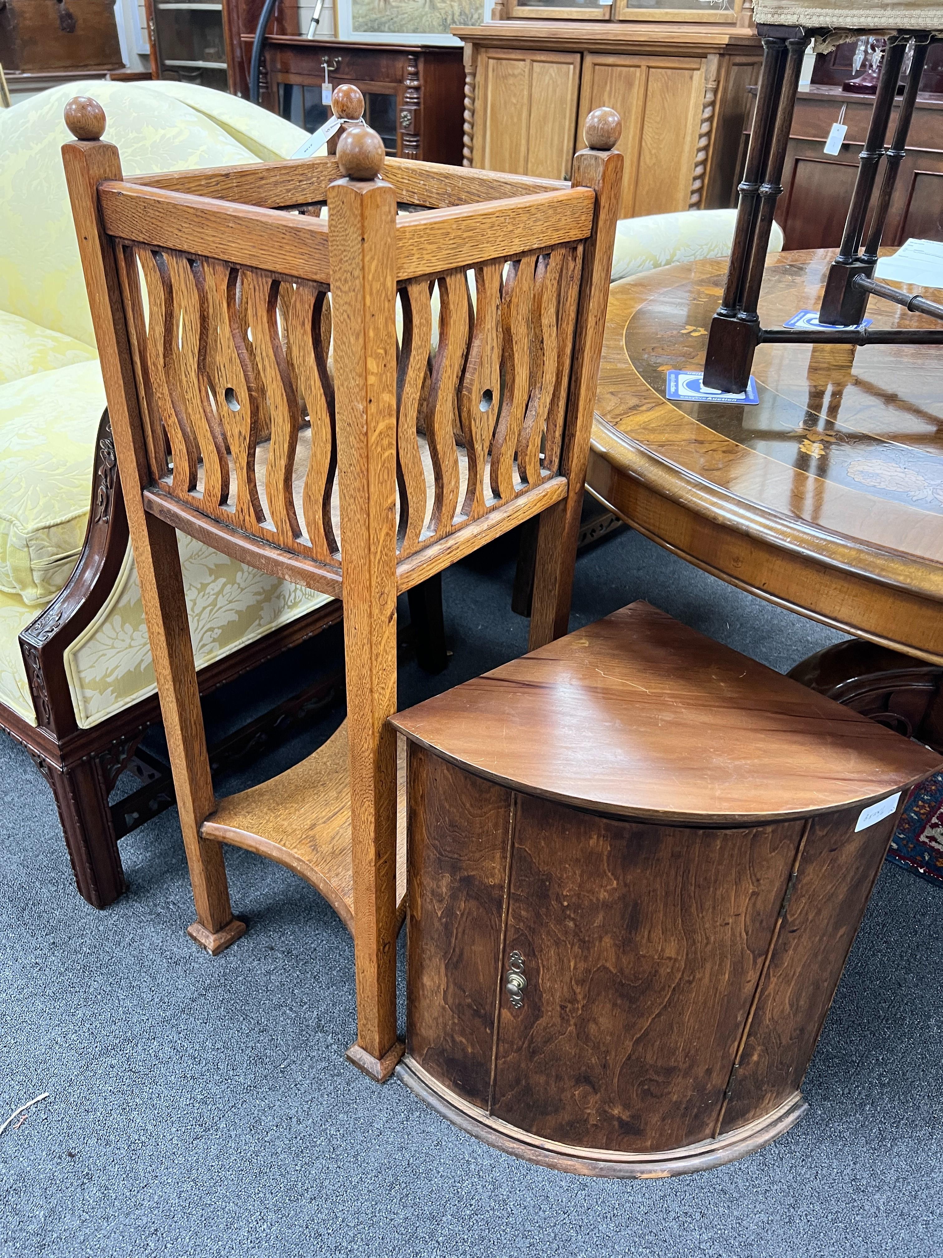 An early 20th century Liberty style oak jardiniere stand, height 95cm together with a small corner cabinet